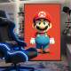 Quadro Decorativo Inspirado em Jogo Super Mario com Fundo Todo Vermelho Ornando com Seu Uniforme